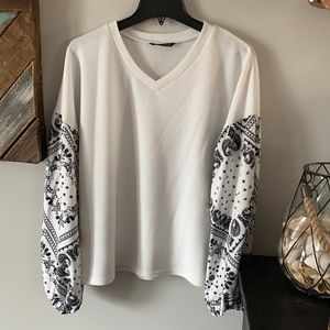 Adorable loose fitting, v-neck Henley